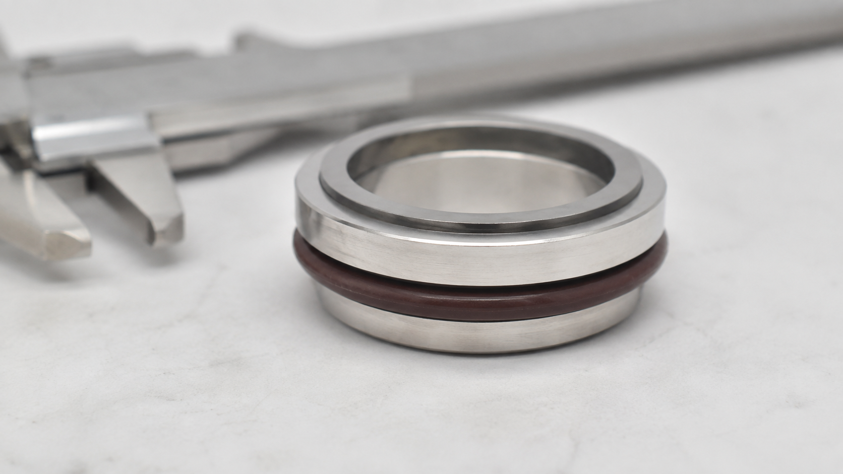 Stationary mechanical seal seat dimensions showing rigid OD ID thickness rubber cup and mounting profile